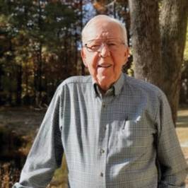 man in front of fence