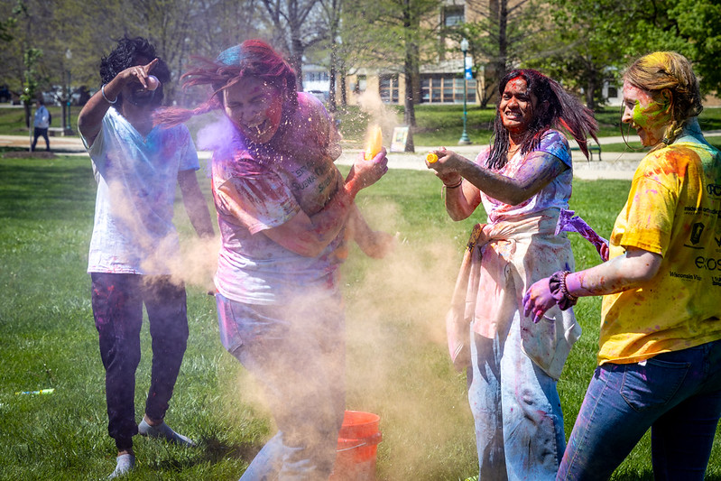 students on quad celebrating Holi