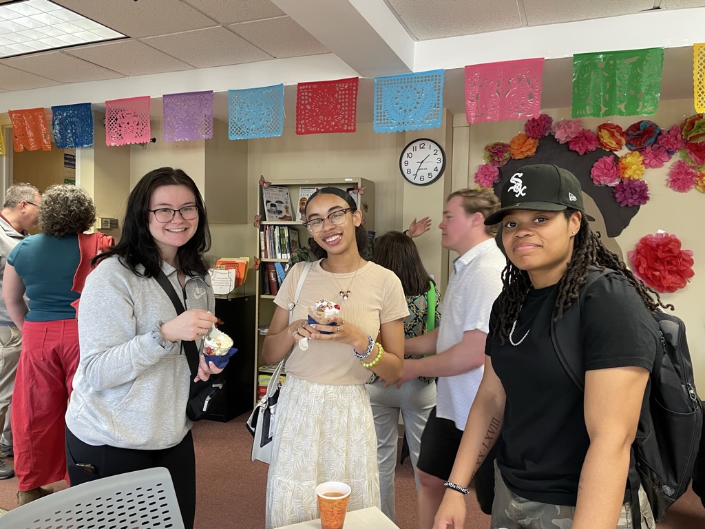 students standing with drinks in hub