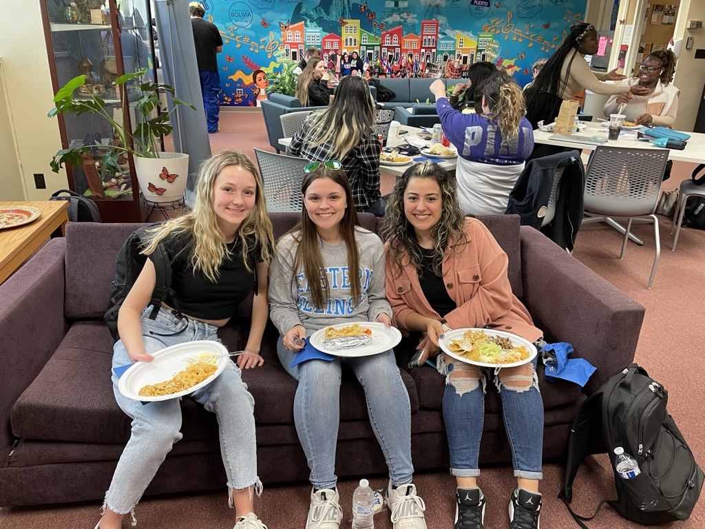 three students on couch