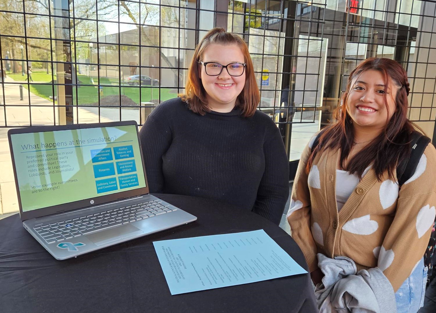 two students and laptop