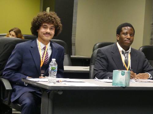 moot court students in suits at desk